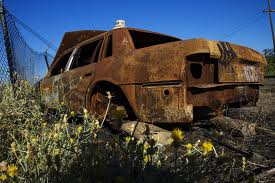 Rusted car instead of shipping container